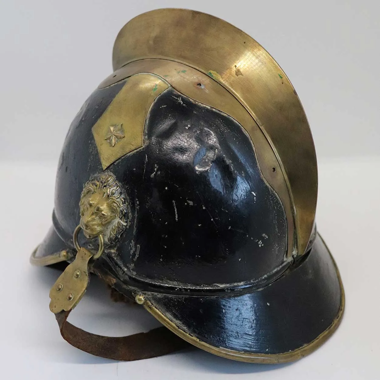 European Brass, Painted Iron and Leather Fire Brigade Helmet