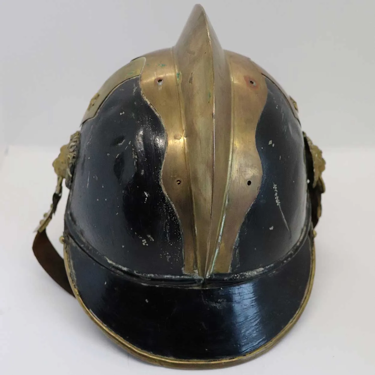 European Brass, Painted Iron and Leather Fire Brigade Helmet