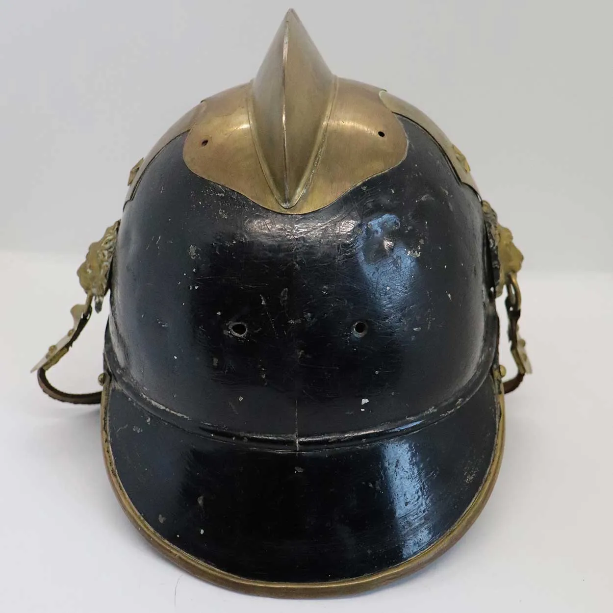 European Brass, Painted Iron and Leather Fire Brigade Helmet